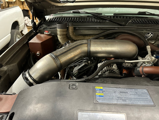 DP Customs Duramax S400 Intake system with polished metal tubing and air filter, designed for diesel truck performance.