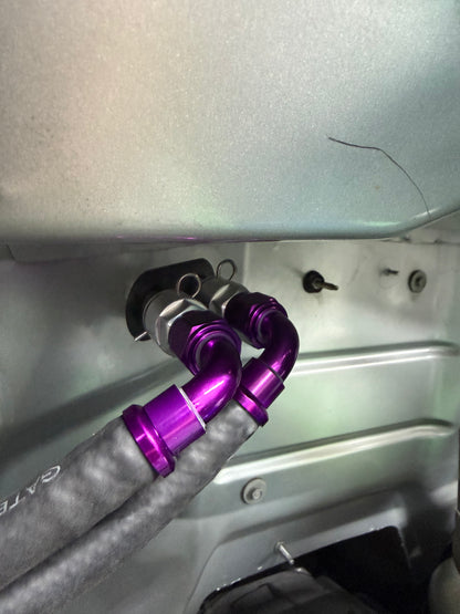 DP Customs billet -10 AN GM heater core adapter fitting, aluminum construction, with threaded ports for automotive coolant connections.