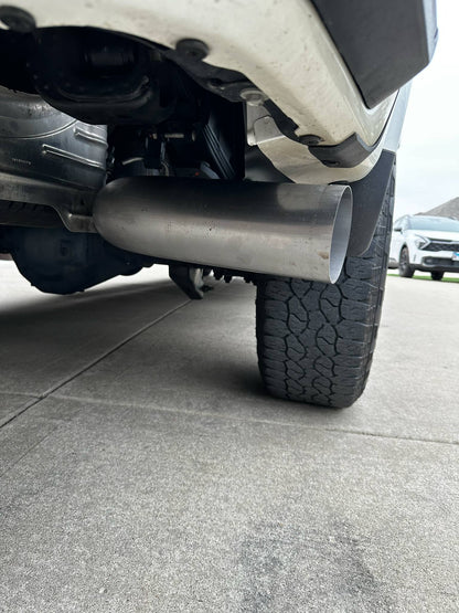 Duramax 2001-2027 stainless steel 5-inch exhaust tailpipe section by DP Customs, showing the polished metal and pipe connection.