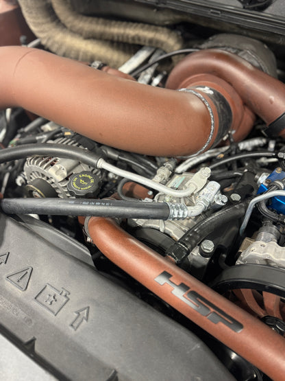DP Customs 03-07 Duramax front route AC suction line showing metal tubing and connectors for vehicle cooling system.