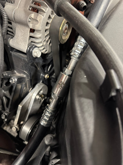 DP Customs 03-07 Duramax front route AC suction line, showcasing the durable metal construction and precise fittings.
