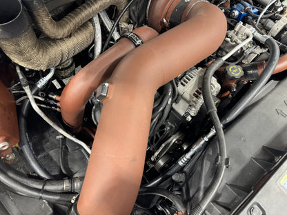 DP Customs 03-07 Duramax front route AC suction line shown in black rubber with metal fittings on ends.