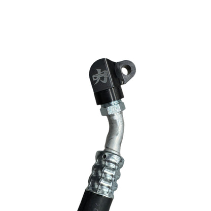 DP Customs 03-07 Duramax front route AC suction line, black metal pipe with fittings, designed for vehicle cooling system.