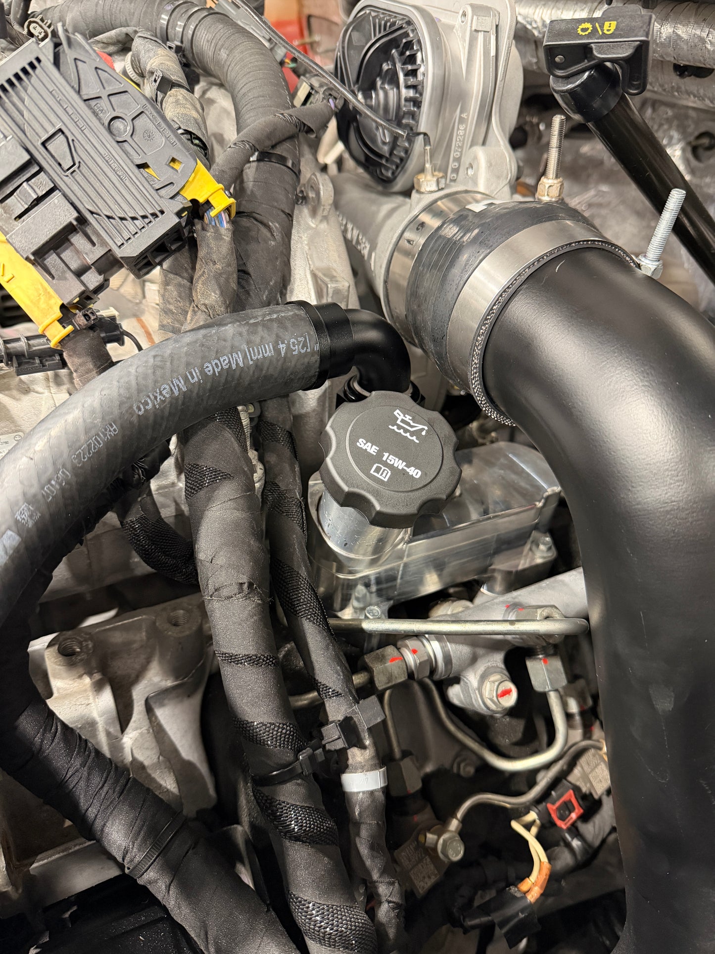 DP Customs 2017-2026 Duramax L5P Billet CCV System showing polished billet aluminum components and fitting details.