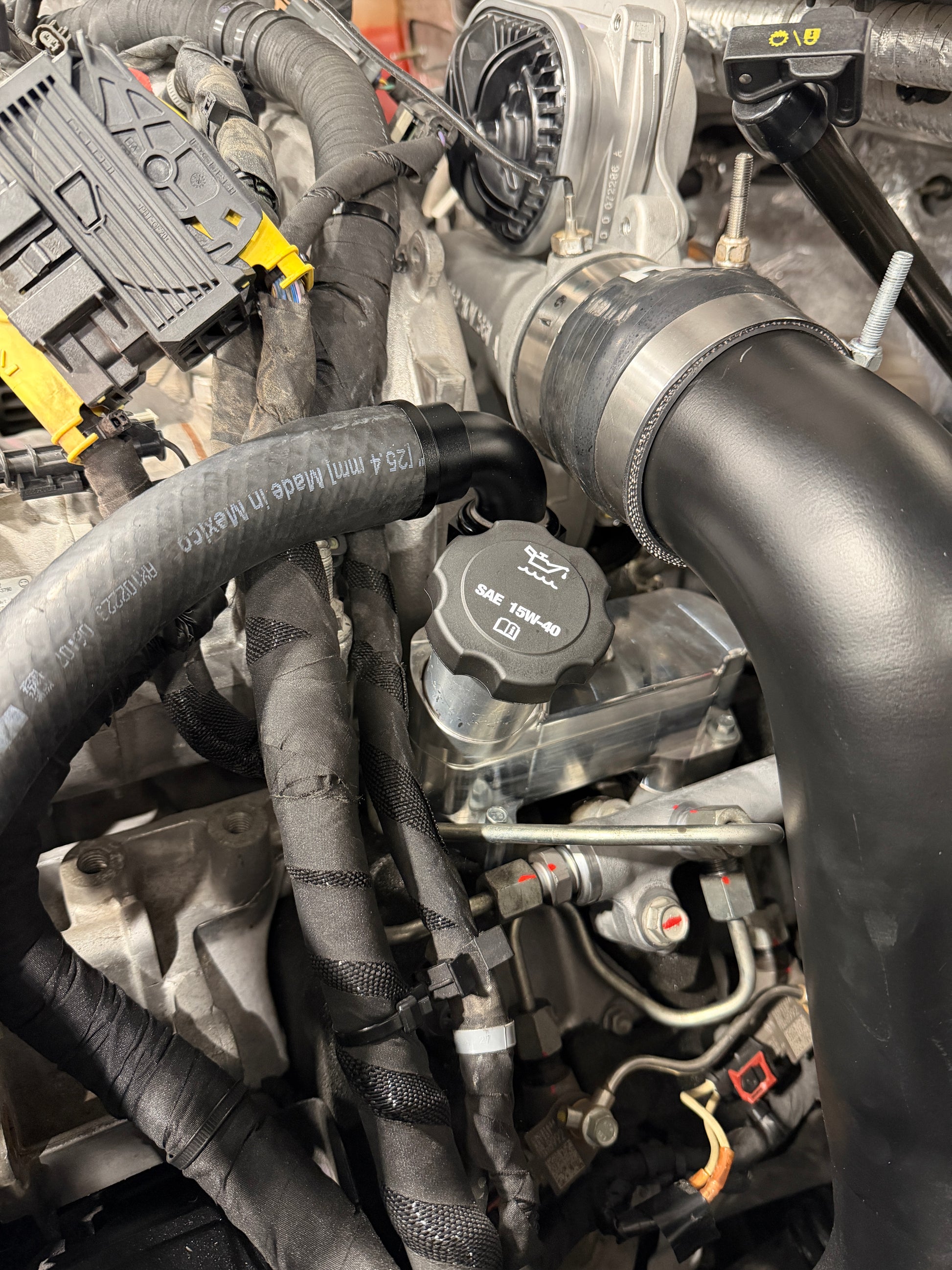 DP Customs 2017-2026 Duramax L5P Billet CCV System showing polished billet aluminum components and fitting details.