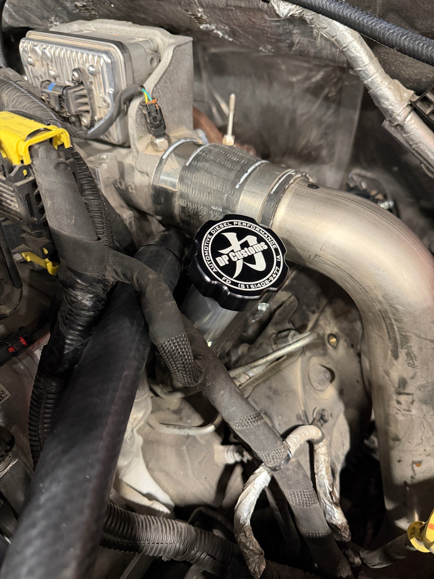 DP Customs 2017-2026 Duramax L5P billet CCV system installed on engine, showcasing high-quality metal construction.