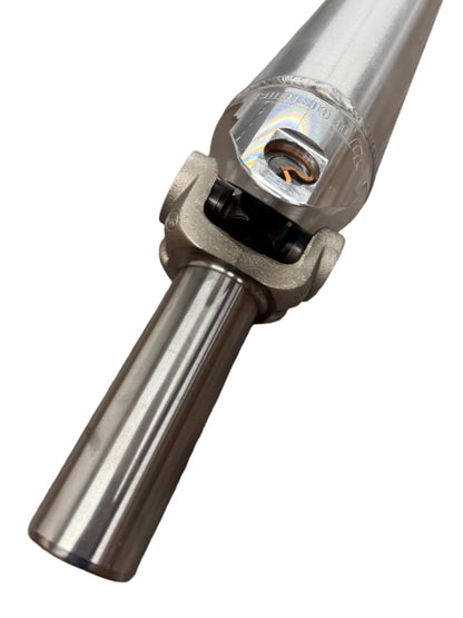 DP Customs 5-inch billet yoke driveshaft for automotive applications, showing the polished metal yoke with precise machining details.