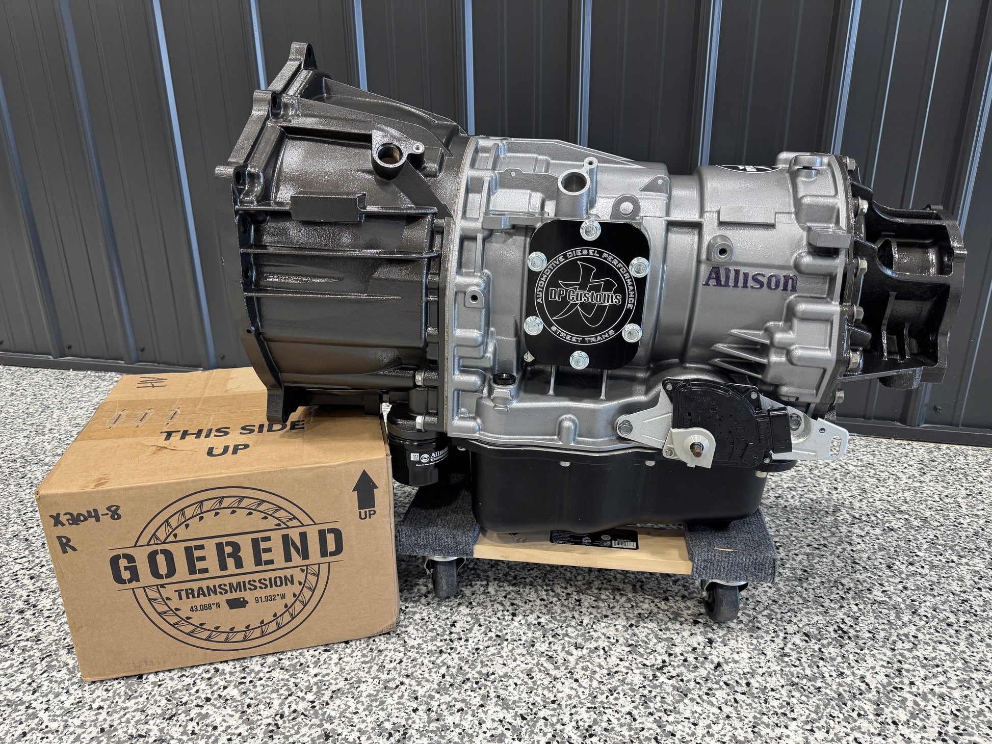 DP Customs Allison 750hp Street Transmission with sturdy metal casing and gear components, designed for high-performance vehicle upgrades.