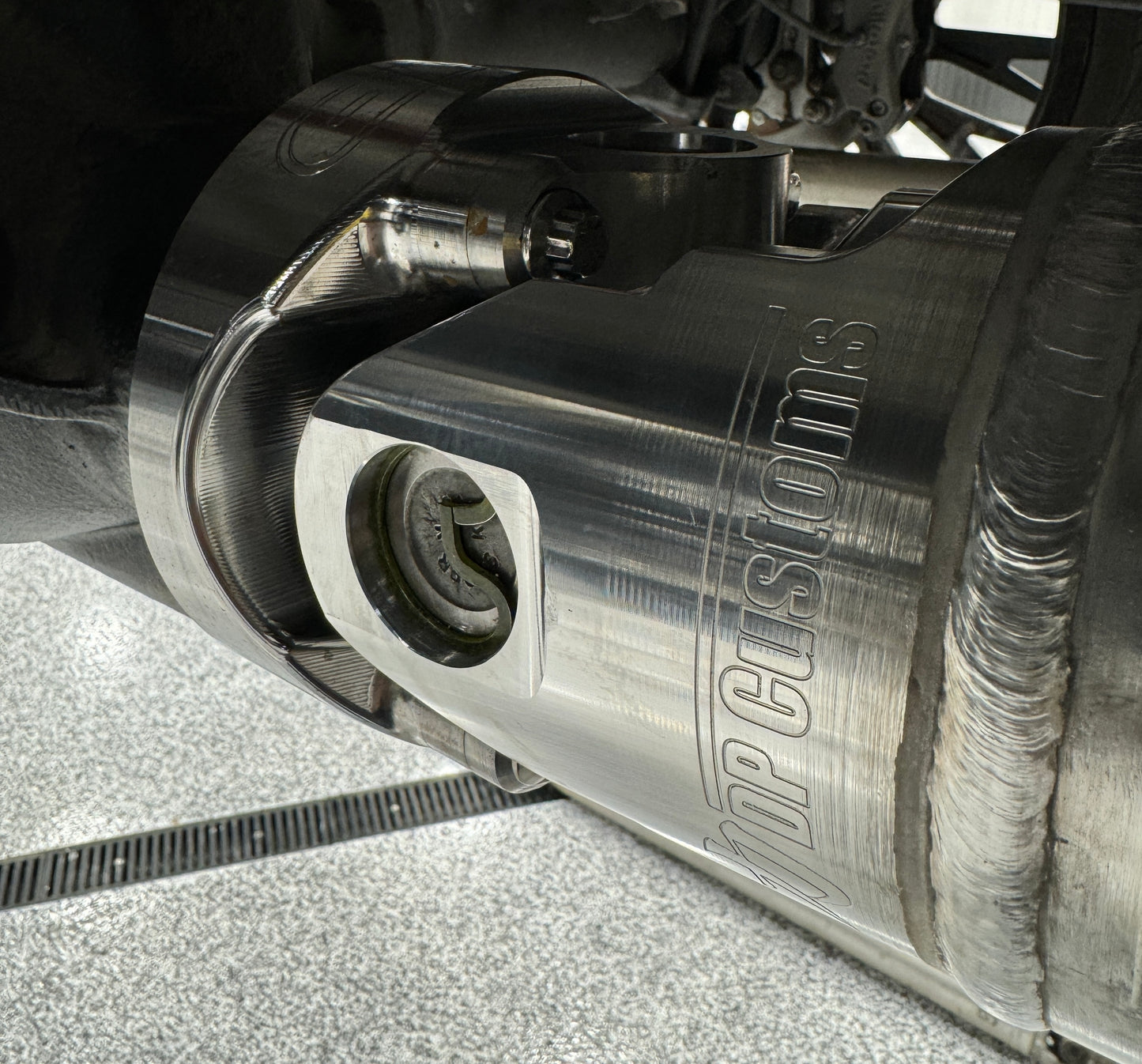 DP Customs Billet 1480 aluminum driveshaft yoke showcasing high-quality CNC-machined metal component with precise engineering features.