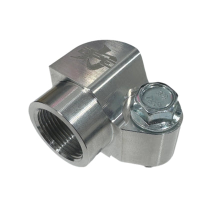 DP Customs billet AC compressor adapter mounted on vehicle engine for improved accessory installation and performance.
