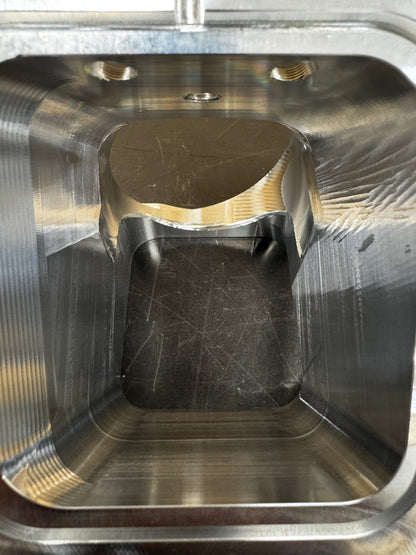 DP Customs Duramax 3.5-inch billet Y bridge for engine intake, showcasing polished aluminum construction and precise machining.