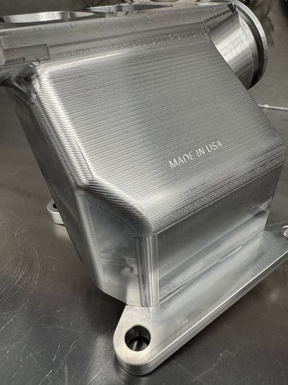 DP Customs Duramax billet T6 wastegate pedestal mounted on engine, showcasing durable metal construction and precision machining.