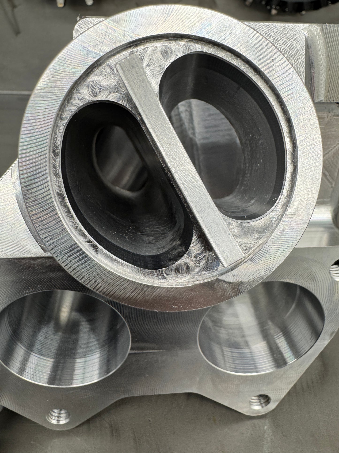 DP Customs Duramax billet T6 wastegate pedestal mounted on a vehicle engine for improved turbocharger performance.
