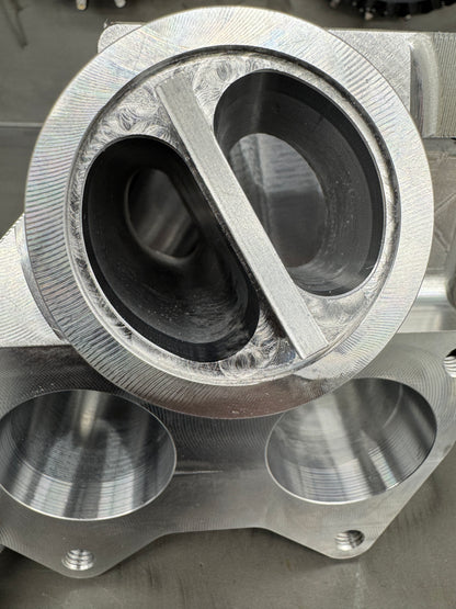 DP Customs Duramax billet T6 wastegate pedestal mounted on a vehicle engine for improved turbocharger performance.