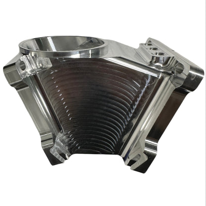 DP Customs Duramax billet Y bridge showing a polished aluminum Y-shaped automotive engine component with intricate machining details.