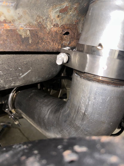 DP Customs Duramax S400 Downpipe showing polished stainless steel construction and precise fit for Duramax diesel trucks.