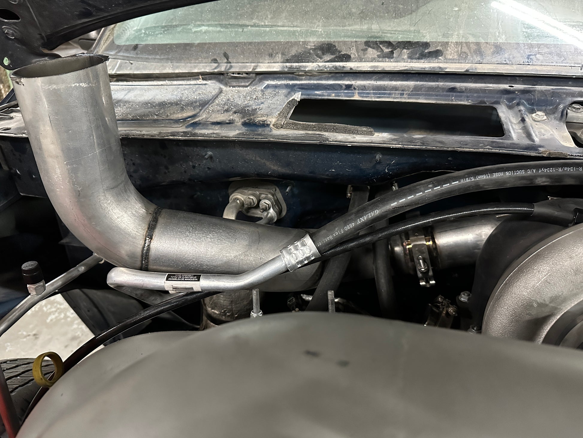 DP Customs Duramax S400 Hoodstack exhaust system installed on a diesel truck, showcasing the chrome finish and custom-fit design.