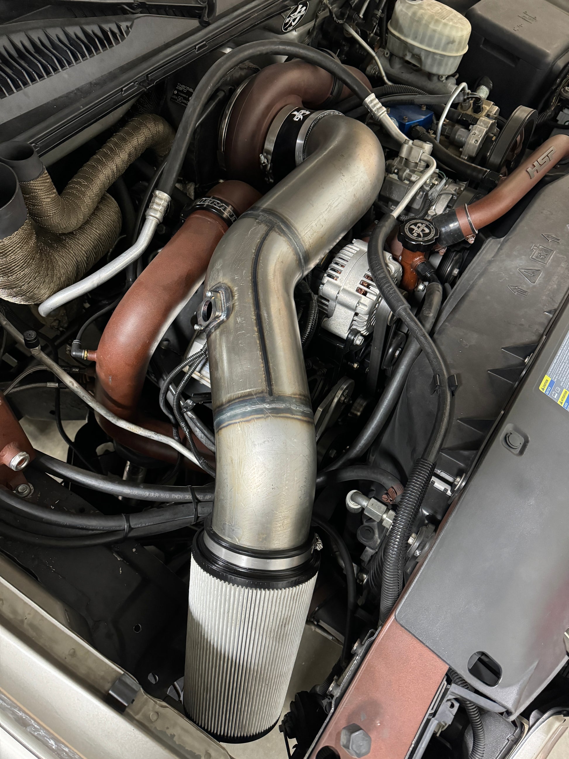 DP Customs Duramax S400 Intake system installed, showing the high-performance air intake with durable tubing for diesel engines.