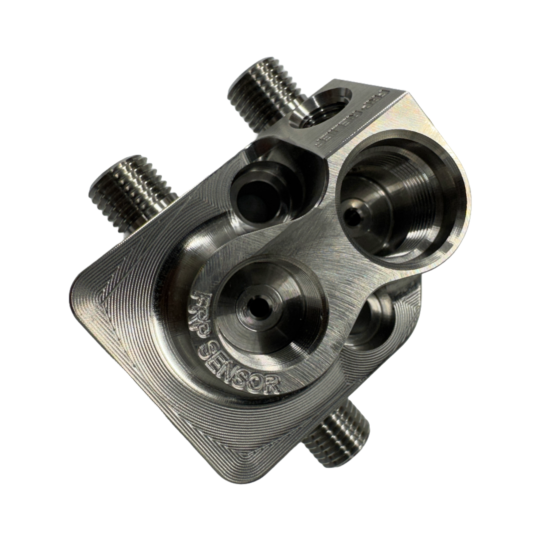 DP Customs LB7 Fuel Distribution Block showing the metal block with multiple fuel line ports for diesel engine setup.