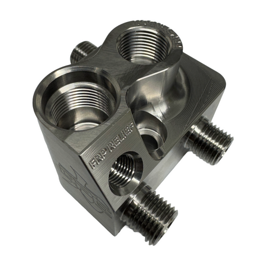 DP Customs LB7 Fuel Distribution Block showing multiple ports and metal construction for diesel engine fuel management.
