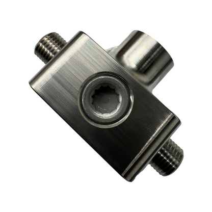 DP Customs LB7 fuel distribution block with multiple ports for engine fuel lines, black metal construction, visible mounting points.