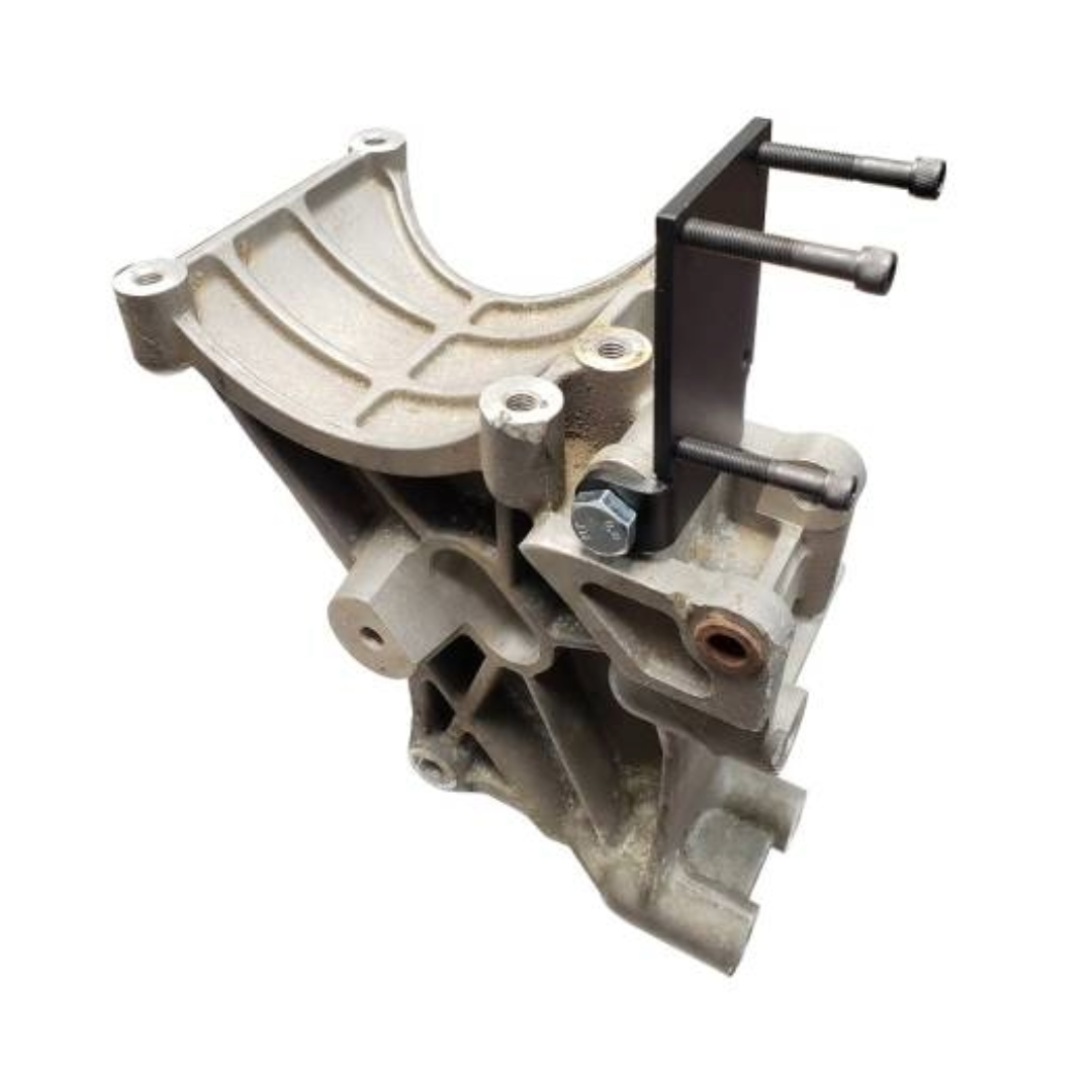 DP Customs SoCal Diesel waterpump bypass bracket mounted on engine, showcasing durable metal construction for diesel truck cooling systems.