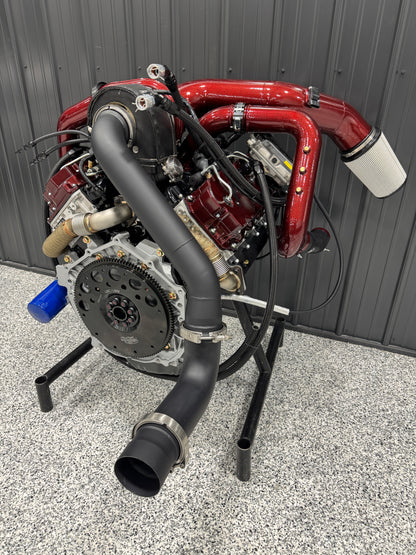 DP Customs DPC LB7 Duramax S400 single turbo kit installed on a Duramax engine, showcasing the turbocharger and piping system.