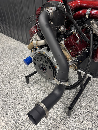 DP Customs DPC LB7 Duramax S400 single turbo kit installed on a diesel engine, showing the turbocharger and exhaust components.