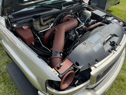 DP Customs DPC LB7 Duramax S400 single turbo kit installed on engine, showcasing high-performance turbocharger components.