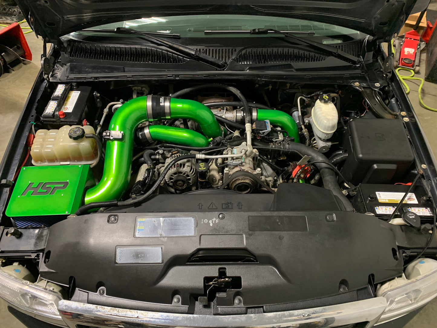 DP Customs HSP LLY Duramax intercooler pipe kit showing polished metal pipes and connectors for diesel truck cooling system.