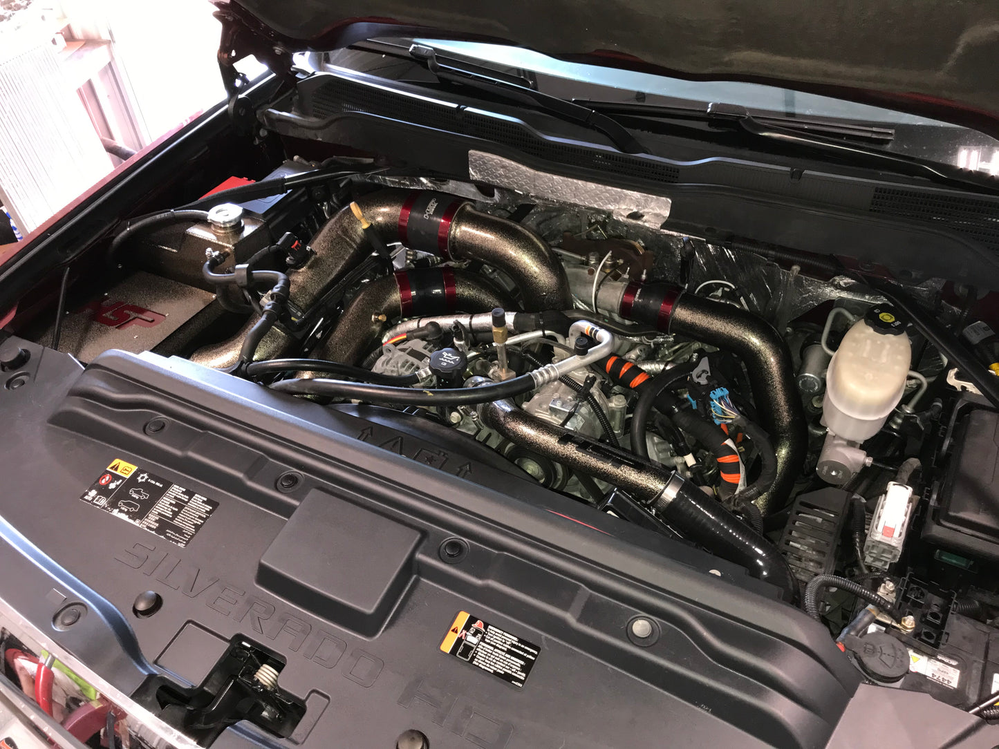 DP Customs HSP LML Duramax Intercooler Pipe Kit installed on a truck, showcasing durable intercooler piping system.