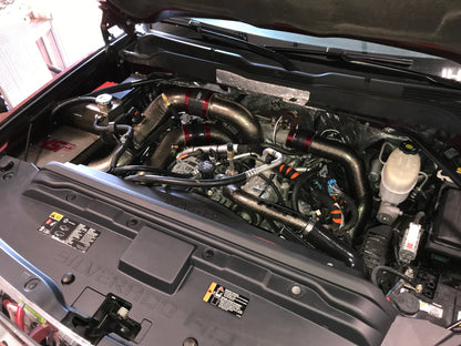 DP Customs HSP LML Duramax Intercooler Pipe Kit installed on a truck, showcasing durable intercooler piping system.