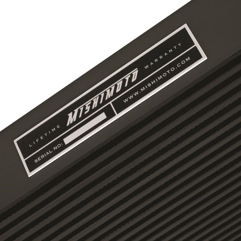 DP Customs Mishimoto intercooler for 2006-2010 Duramax diesel trucks, showing the large core and mounting brackets.