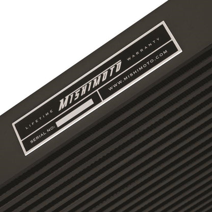 DP Customs Mishimoto intercooler for 2006-2010 Duramax diesel trucks, showing the large core and mounting brackets.