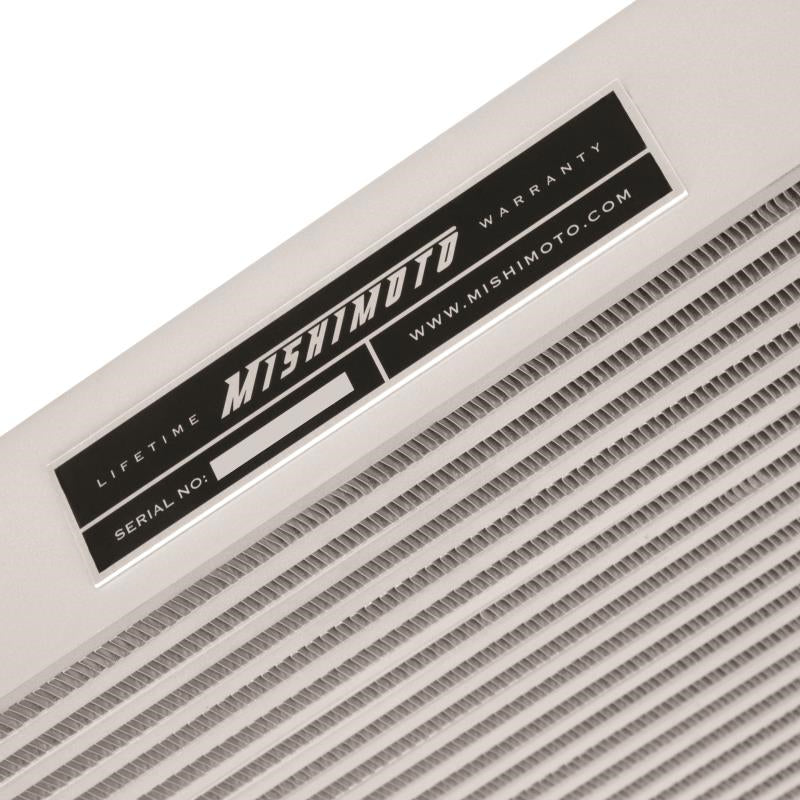 DP Customs Mishimoto intercooler for 2006-2010 Duramax diesel engine, featuring aluminum construction and core design.