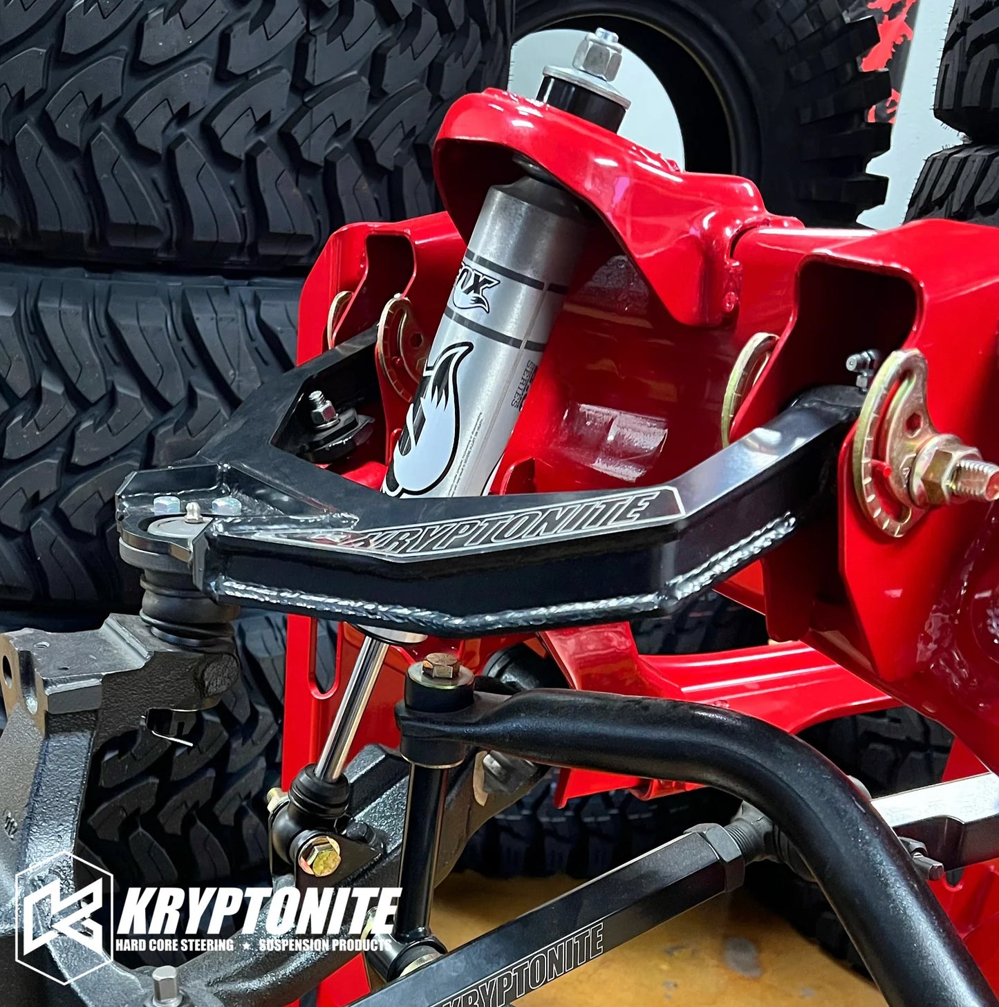 Kryptonite Products upper control arm kit with metal arms and bushings for automotive suspension repair.