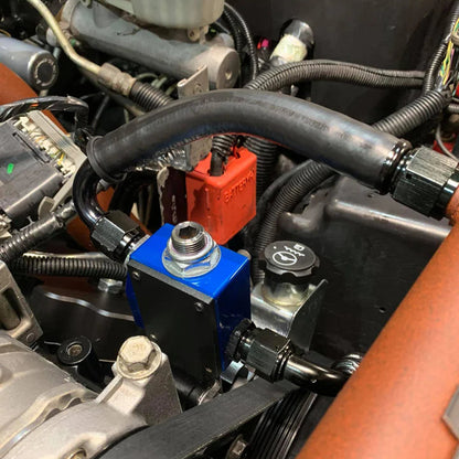 SoCal Diesel Water Pump Bypass kit showing metal components and hoses for vehicle water pump bypass system