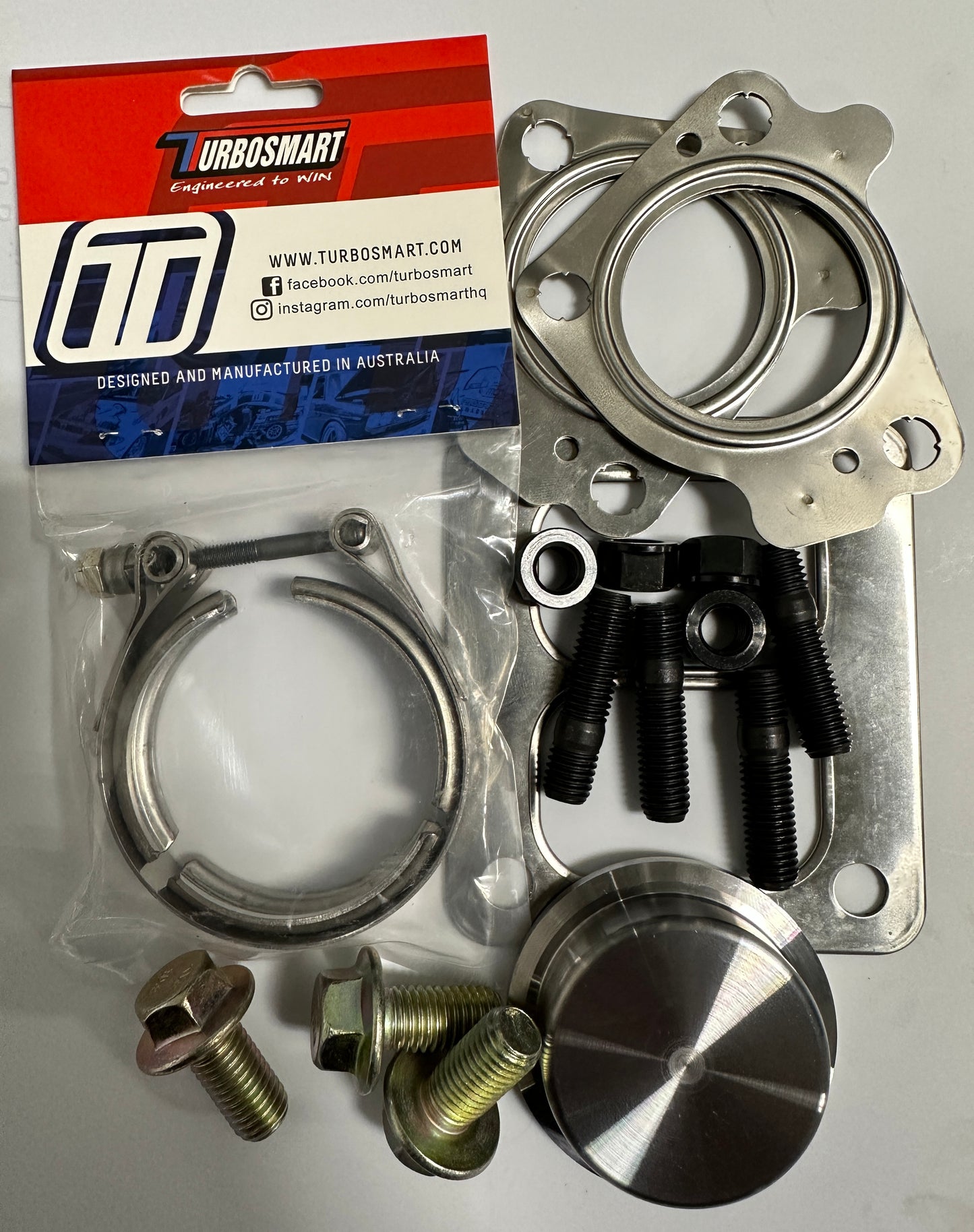 DP Customs Duramax Billet T4 Wastegate Pedestal showing sleek metal construction and detailed branding for turbocharger upgrade.
